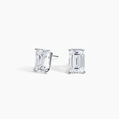 Emerald Cut Diamond Stud Ears (1 ct. tw.) - 18K White Gold. These sleek and eye-catching stud earrings feature glistening emerald-shaped diamonds secured by guardian backs. Spring 23, Emerald Cut Moissanite, Emerald Cut Diamond, Moissanite Earrings, Diamond Stud Earrings, Diamond Stud, Emerald Cut Diamonds, Accessories Jewelry Earrings, Precious Metal