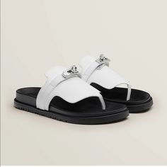 Brand New! Never Worn! Hermes Empire Sandal. Color Blanc. Size 37. Comes With Box And Bag. Techno-Sandal In Calfskin With Anatomical Sole And Iconic Palladium Plated Kelly Buckle. Black Rubber Sole. Palladium Plated Buckle. Black Goatskin Insole. White Calfskin Lining Luxury Designer White Sandals, Hermes Sandals Pool, Bvlgari Sandals, Hermes Oran Sandals, Comfortable Chic, Hermes Shoes, Party Style, Urban Chic, Casual Street Style