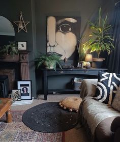 a living room filled with furniture and plants