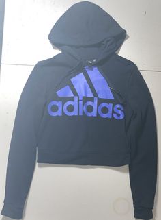 Adidas Women Crop Top Hoodie Pullover Long Sleeve Sweatshirt Size XS Blue. Your looking at a nice crop top hoodie that doesn’t have any major flaws or stains. If so, they are shown in the pictures. All pre-owned clothes are cleaned according to eBay standards with no perfumes or scents. We ship daily and accept free returns. These items are stored in a smoke free home. Dog (see profile pic❤️ )is kept away from eBay room. Note that all measurements are approximate, and previously washings may hav Blue Logo Print Sweatshirt In Athleisure Style, Blue Logo Print Sweatshirt Athleisure Style, Adidas Athleisure Hoodie With Crew Neck, Adidas Sweatshirt With Letter Print For Sports, Adidas Sports Hoodie With Crew Neck, Adidas Hooded Top With Ribbed Cuffs, Adidas Tops With Drawstring Hood And Crew Neck, Adidas Sporty Sweatshirt With Letter Print, Adidas Long Sleeve Hoodie In Sportswear Style