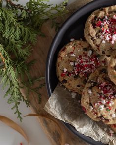 chocolate chip cookies with sprinkles in a black bowl on a wooden table