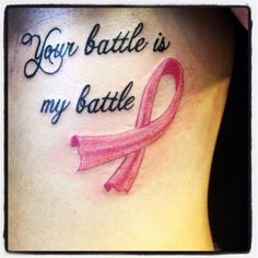 a woman's stomach with a pink ribbon on it that says your battle is my battle