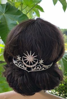 a woman wearing a tiara in her hair