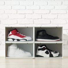 four pairs of sneakers are in a box