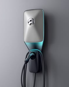 an electric charger plugged in to a wall with a gray and blue background