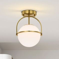 a light fixture in a room with white walls