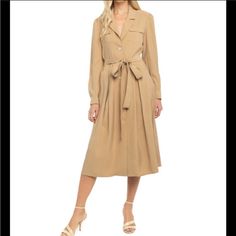 Lani The Label. Long Sleeve, Camel Colored Dress. Button Down. Optional Tie At The Waist. Can Wear Buttons Done Up Or Not. Mid-length Shirt Dress With Button Closure For Work, Elegant Fall Dress With Buttoned Pockets, Midi-length Shirt Dress With Buttoned Pockets For Work, Workwear Midi-length Shirt Dress With Buttoned Pockets, Beige Button-up Shirt Dress For Office, Beige Shirt Dress With Button Closure For Office, A-line Midi Dress With Buttons For Date Night, Midi Length Shirt Dress With Button Closure, Beige Long Sleeve Single Breasted Dress