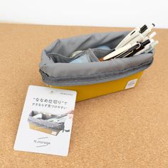 The Kokuyo N-Storage features a zipper closure that when open, rolls back allowing you to see all of its contents. Each pocket is at a diagonal keeping things easy to find and accesible. This pencil case has a medium holding capacity. The interior of the pencil case has a square deep pocket which can hold up to 13 pens. There is a shallow diagonal pocket perfect for holding an eraser, correction tape, or other small tool. Then finally there is a deep long rectangular pocket, perfect for holding Correction Tape, The Pencil, Blog Branding, Paper Houses, Memo Pad, Letter Paper, Ink Pads, Stationery Notebook, Stationery Set