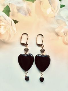 Black heart earrings--Triple hearts! These black hearts have gold hearts above them and smaller black hearts that dangle from below. Perfect for a more dramatic look or those days when only a black heart will do.  Length: 2.5 inches Black Heart Earrings, Triple Heart, Swarovski Crystal Necklace, Glass Heart, Black Heart, Heart Of Gold, Heart Earrings, Gold Chains, Crystal Necklace