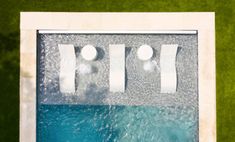 an aerial view of a pool with two people in it