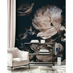 an elegant living room with large flowers on the wall