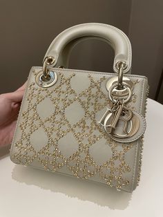 Dior Embellished Lady DiorGold Lambskin LGHWMini 15 x 17 x 7 cmStrap drop 48 cm9.8-9.9/10 Like NewIncludes box, dust bag and bookletPrice now 4900 sgd  3620 usd CN5694-01 Gold Dior Bag, Lady Dior Bag Outfit, Miss Dior Bag, Dior Outfit, Bags Brands, Luxury Fashion Brands, Lady Dior Handbag, Dior Gold, Luxury Bags Collection