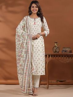 Women Floral Printed Regular Beads and Stones Pure Cotton Kurta with Palazzos & With PRODUCT DETAILS  Cream-coloured printed Kurta with Palazzos with dupatta Kurta design: Floral printed Straight shape Regular style Round neck, three-quarter regular sleeves 2 pockets beads and stones detail Calf length length with straight hem Pure cotton machine weave fabric Palazzos design: Solid Palazzos Partially elasticated waistband Slip-on closure Size & Fit The model (height 5'8) is wearing a size S Mate Traditional Off-white Floral Print Sets, Festival Off White Dupatta With Printed Motifs, White Bohemian Sets With Digital Print, Bohemian White Set With Digital Print, Traditional Cream Sets With Printed Motifs, Traditional Cream Sets With Floral Print, Traditional Cream Floral Print Sets, Cream Sets With Printed Motifs For Festivals, Cream Festival Sets With Printed Motifs