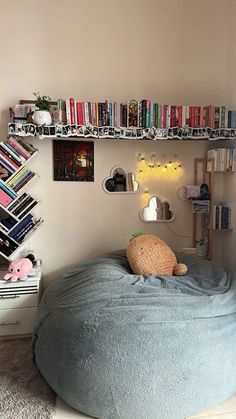 there is a bean bag chair in the corner of this room with bookshelves