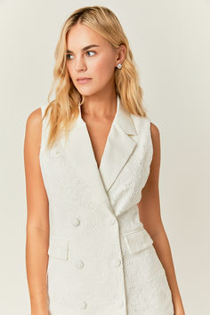 This classic blazer mini dress offers a timeless look. Featuring a slim fit with a mini length this dress is perfect for the office or a night out. Make a statement with the sleek sleeveless design. Tailored Spring Mini Dress, Tailored Mini Dress For Spring, Tailored Mini Dress For Spring Formal, Tailored Mini Dress For Spring Formal Occasions, Tailored Mini Dress For Spring Formal Events, Tailored Mini Dress For Formal Spring Events, Elegant Semi-formal Spring Vest, Sleeveless Formal Mini Dress, Chic Tailored Mini Dress