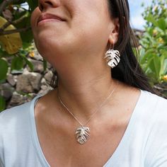 The Monstera Necklace is perfect for an island girl! Ou Monstera Pendant is approximately 1 ½ inches long The chain is adjustable from 16 to 18 inches This necklace matches our Monstera Earrings A portion of all sales go to organizations that protect native Hawaiian plants and animals Nature-inspired Silver Jewelry With Adjustable Chain, Nature-inspired Fair Trade Jewelry For Gifts, Adjustable Sterling Silver Jewelry With Large Pendant, Fair Trade Nature-inspired Jewelry For Gifts, Sterling Silver Pendant Jewelry With Adjustable Length, Sterling Silver Pendant With Adjustable Length, Fair Trade Pendant Jewelry For Gifts, Nature-inspired Adjustable Hypoallergenic Jewelry, Nature-inspired Sterling Silver Jewelry With Large Pendant