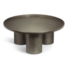 a round metal table with three legs on the bottom and one leg raised to the side