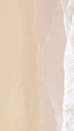 an aerial view of the ocean and beach