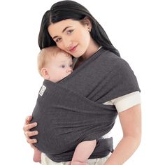 a woman holding a baby in a grey wrap