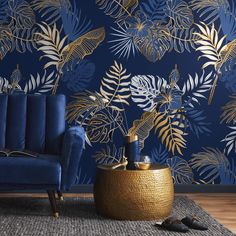 a living room with blue and gold wallpaper