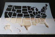 the cut out map of the united states is displayed on a piece of plywood