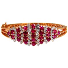 Victorian Ruby Cluster 5.06ct. Natural Ruby Bangle bracelet. Round cut, Fully Faceted. Vibrant Red, excellent Sparkle. Clean Clarity & Transparent. 1.10ct. natural diamonds: Rounds, Full Cut G- color / Vs-2 clarity Secure pressure clasp and safety catch. 24.5 grams. 14kt. rose gold. Measures 7 inches (wearable length) 18.7mm wide. $12,000 Appraisal Certificate to accompany Luxury Red Diamond Jubilee Bracelet, Luxury Red Tennis Bracelet, Red Luxury Jubilee Tennis Bracelet, Red Diamond Fine Jewelry Bracelet, Red Diamond Bracelets Fine Jewelry, Luxury Red Diamond Bracelet For Weddings, Luxury Red Diamond Wedding Bracelet, Luxury Red Diamond Bracelet For Formal Occasions, Luxury Red Gold Bracelet For Formal Occasions