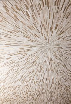 the ceiling is made up of wood and has an intricate pattern on it's surface