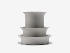 three white bowls stacked on top of each other