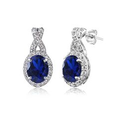 PRICES MAY VARY. FEATURE - These charming earrings for women showcase oval created blue sapphire gemstones delightfully set below white topaz studded X designs. These drop earrings enhance your daytime and evening attire. Add an additional piece to your fine sapphire jewelry and gemstone jewelry collection. CRAFTED - These jewelry earring drops are crafted of 925 sterling silver, nickel free and tarnish free. They secure with post and friction backs. CARE - Keep from water cosmetics & chemical p Oval Lab-created Sapphire Jewelry With Halo Design, Sapphire Cubic Zirconia Oval Earrings, Oval Sapphire Cubic Zirconia Earrings, Elegant Oval Lab-created Sapphire Jewelry, Oval Birthstone Earrings In Cubic Zirconia, Oval Cubic Zirconia Birthstone Earrings, Fine Jewelry Display, White Topaz Earrings, Beautiful Tiaras