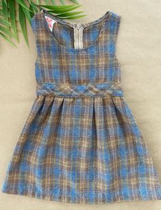 "This super cute pre-loved vintage 1960s dress by Majdell is a timeless classic. Would be a perfect autumn outfit, paired with tights and some black shoes.  Brand: Majdell  Material: 40% Acrylic, 30% Polyester, 25% Wool, 5% Other Fibers Size: 3T Made in Canada Circa 1960s Because all items in the shop are pre-loved, clothing may come with some signs of wear. I strive to be extremely transparent about imperfections, so please take a close look at the description and pictures to avoid disappointment. All items are sold \"as-is\" and all sales are final. Sorry, no returns, refunds or exchanges. If there are any issues with your order, please let me know." Fitted Brown Plaid Dress For Spring, Fitted Brown Plaid Dress For Fall, 1970s Dress, Vintage Dresses 1960s, 1960s Dress, 1970s Dresses, 1960's Dress, Little Outfits, Blue And Brown