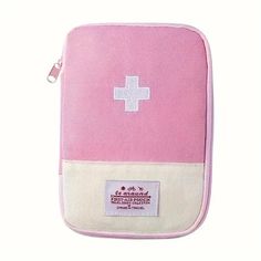 a pink and white bag with a cross on it