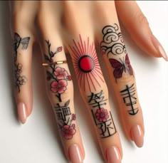 a woman's hand with tattoos on it