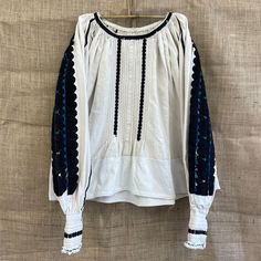 Beautiful handmade 1970s traditional folk Romanian blouse with black embroidery mostly on the sleeve. made in the Nadăș community in Arad , Romania hemp and cotton mix Size S Each item is special and unique so may come with some beautiful little imperfections : ) Message me if you have any questions xx Traditional Peasant Top With Floral Embroidery For Fall, Fall Folk Peasant Top With Intricate Embroidery, Traditional Fall Peasant Top With Floral Embroidery, Spring Folk Blouse With Woven Motifs, Fall Embroidered Sleeves Peasant Top, Fall Festival Peasant Top With Embroidered Sleeves, Fall Peasant Top With Embroidered Sleeves, Bohemian Long Sleeve Blouse With Woven Motifs, Bohemian Blouse With Woven Motifs And Long Sleeves