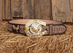 Unique handcrafted western leather belt with horse shoe design stitching and rooster belt buckle Traditional Brown Belt Buckles With Matching Belt, Traditional Brown Belt Buckles, Western Brown Embroidered Belt, Embroidered Brown Belt Buckle For Rodeo, Brown Embroidered Belt Buckles For Western-themed Events, Brown Belt With Antique Buckle For Ranch, Hand Tooled Brown Belt Buckles For Rodeo, Western Brown Belt Buckles For Rodeo, Brown Hand Tooled Belt Buckles For Rodeo