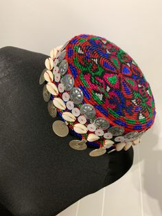 This style of hat. It is increasingly worn by tribal Pashtuns in Afghanistan and Pakistan and has began wearing it at wedding party. The hat, in traditional vintage style, has paise coins, hand-stitched onto it. Bohemian Handmade Costume Hats For Festivals, Handmade Bohemian Hats And Headpieces For Festivals, Traditional Adjustable Flat Cap Costume, Bohemian Handmade Costume Hats And Headpieces For Festivals, Handmade Bohemian Costume Hats And Headpieces For Festivals, Traditional Adjustable Multicolor Turban, Traditional Multicolor Beaded Hat, Traditional Adjustable Costume Hats For Festivals, Bohemian Handmade Headpiece With Round Crown