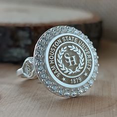 You can send all your questions about my store and products via message. In this description, all the details of the product are explained to you. *The logo of any university you want can be made. * Ring Face: Round *We can use the stone colors you want in the ring. *I can make our rings in 10K, 14K, 18K and 22K gold. *The ring is 925 Sterling Silver. *We can change the color of the stone in the ring. All colors are available. *The ring has My Brand and 925K stamps on it. *Before the rings are p Personalized Silver Crystal Ring, Customized Adjustable Silver Rings, Customized Silver Engraved Ring Adjustable, Customized Silver Engraved Adjustable Ring, Customized Silver Engraved Ring With Adjustable Fit, Customized Adjustable Silver Engraved Ring, Coat Of Arms Logo, High School Rings, Class Rings College