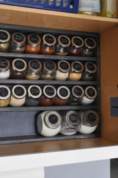 an organized spice rack with jars and spices