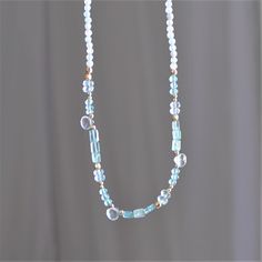 "Natural Aquamarine Necklace for Women, Handmade Jewelry Stunning and chic this beaded aquamarine necklace is the perfect everyday necklace or gift.  Aquamarines are a symbol of courage.  D E T A I L S *Gorgeous, genuine and natural aquamarine with touches of apatite beaded by hand  *Adorned with 14kt gold filled accents   Water friendly  LENGTH  *Choose a 16 inch length of a 16 inch with a 2 inch extender for up to 18 inches.  *Model is wearing 16\" in photos.  HOW TO PERSONALIZE *Select your c Light Blue Aquamarine Necklace With Gemstone Beads, Light Blue Aquamarine Gemstone Beads Necklace, Light Blue Gemstone Beaded Necklace Gift, Light Blue Gemstone Beads Necklace For Gift, Aquamarine Bead Necklaces For Gifts, Aquamarine Round Beads Necklace For Gift, Turquoise Aquamarine Round Bead Necklaces, Everyday Blue Gemstone Beaded Necklaces, Blue Beaded Necklaces With Gemstone Beads