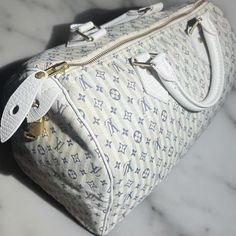 In Amazingly Beautiful Condition!! This Is An Authentic Louis Vuitton Mini Lin Croisette Speedy 30 In Blue. This Is An Attractive Louis Vuitton Classic In A Blue On White Monogram Canvas. It Has The Traditional Speedy Construction With White Cowhide Rolled Leather Handles And Piping For Structure. There Is Minimal Hardware Including Brass Handle Links, Studs And A Full Top Zipper With A Padlock. The Interior Is A White Fabric With A Hanging Patch Pocket. This Charming Handbag Will Be A Favorite Louis Vuitton Makeup Bag White, Lv Handbags Light Gray, Lv Handbags White, Silver Louis Vuitton Bag, Louis Vuitton White Bag, Speedy 30, Authentic Louis Vuitton, Brass Handles, Monogram Canvas