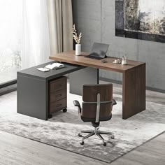 an office desk with a chair and laptop on it