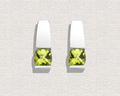 "Peridot Earrings - Argentium Silver - 2431 A contemporary, yet timeless design by award winning designer, David Worcester. Cast in Argentium 960 premium quality 100% recycled silver, these earrings are specially processed for tension setting. They measure 18mm x 7mm (3/4 x 1/4\") inches, and hold six millimeter antique square checkerboard cut Peridot. PLEASE LOOK AT THE MEASUREMENTS CAREFULLY. SOME PHOTOS HAVE BEEN ENLARGED TO SHOW DETAIL, WHILE OTHERS HAVE BEEN MINIMIZED TO FIT THE FRAME. ACTU Modern Peridot Jewelry For Formal Occasions, Modern Green Earrings, Green Modern Sterling Silver Earrings, Modern Green Sterling Silver Earrings, Modern Green Peridot Jewelry, Modern Green Earrings For Anniversary, Modern Green Earrings With Polished Finish, Tension Setting, Peridot Earrings