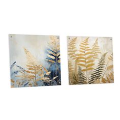 two metal wall art pieces with gold and blue leaves on the left, one has a fern