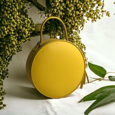 "A round tote  bag  with a handle will help to emphasize your femininity, it will always effectively emphasize your image and will help to free your hands from the little things that always clutter up your pockets. The leather work tote bag not only complements your style, but also becomes a roomy bag for every day, work or walk. The yellow color of the skin, the quality of work, the silhouette of the bag are created for a true connoisseur of beauty. Product information:  *Italian leather  * ski Leather Bags With Round Handle For Gifts, On-the-go Satchel With Round Handle, On-the-go Shoulder Bag With Round Handle, Daily Use Shoulder Bag With Round Handle, Gift Shoulder Bag With Top Carry And Round Handle, Everyday Bucket Bag With Round Handle, Leather Shoulder Bag With Detachable Handle In Round Shape, Round Case Bag With Detachable Handle, Leather Shoulder Bag With Detachable Handle And Round Case