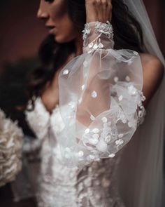 a woman wearing a wedding dress and veil