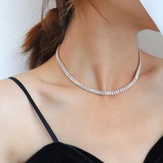 Most items are not restocked. Elevate your neck game with this exquisite Tennis necklace, a stunning piece that exudes elegance and glamour. Meticulously crafted with high-quality stainless steel, this beauty ensures long-lasting durability and fade-free shine. Adorned with clear or green cubic zirconia stones, it glistens with an alluring sparkle that is sure to turn heads. The heavy layer of 18K gold adds a touch of luxury and leaves a thick layer to prevent any wearing off. With its perfect f Luxury Diamond Choker Necklace, Luxury Sparkling Stones Choker Necklace, Elegant Luxury Heavy Necklace, Luxury Choker Necklace With Sparkling Stones, Luxury Gold Cubic Zirconia Tennis Necklace, Luxury Cubic Zirconia Tennis Necklace, Luxury Cubic Zirconia Tennis Necklace With Sparkling Stones, Luxury Gold Cubic Zirconia Choker, Luxury Clear Necklace