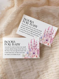 two business cards sitting on top of a bed with the words boo's too baby