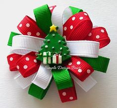 a red and green christmas tree hair bow