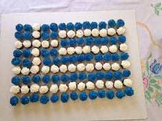 an american flag made out of blue and white cupcakes