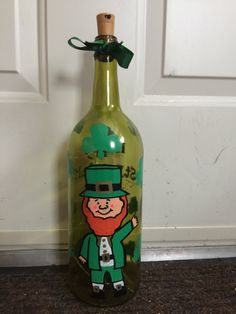 a glass bottle with a st patrick's day design on it