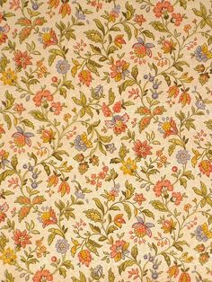 a floral wallpaper with many different colors and designs on the surface, including flowers